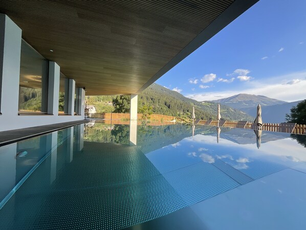 Outdoor pool, open 4:00 PM to 8:00 PM, pool umbrellas, pool loungers