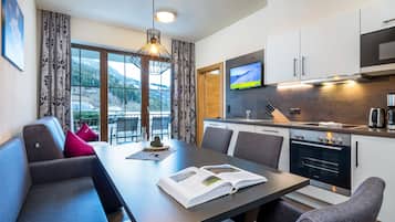 Classic Apartment | Living room | 32-inch flat-screen TV with cable channels, TV, heated floors