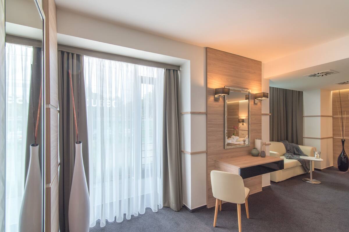 deluxe suite | premium bedding, in-room safe, desk, soundproofing