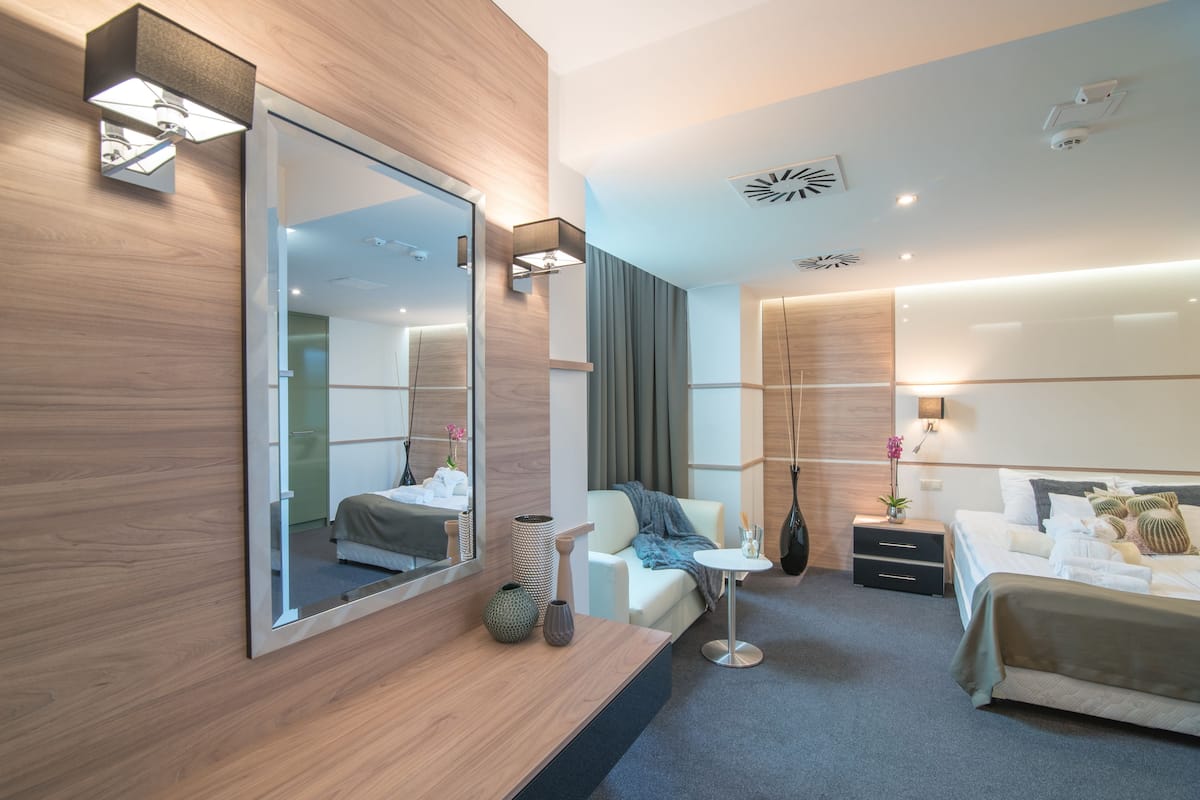 deluxe suite | premium bedding, in-room safe, desk, soundproofing