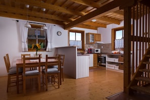 Comfort Chalet, 3 Bedrooms | Living area | Flat-screen TV, fireplace