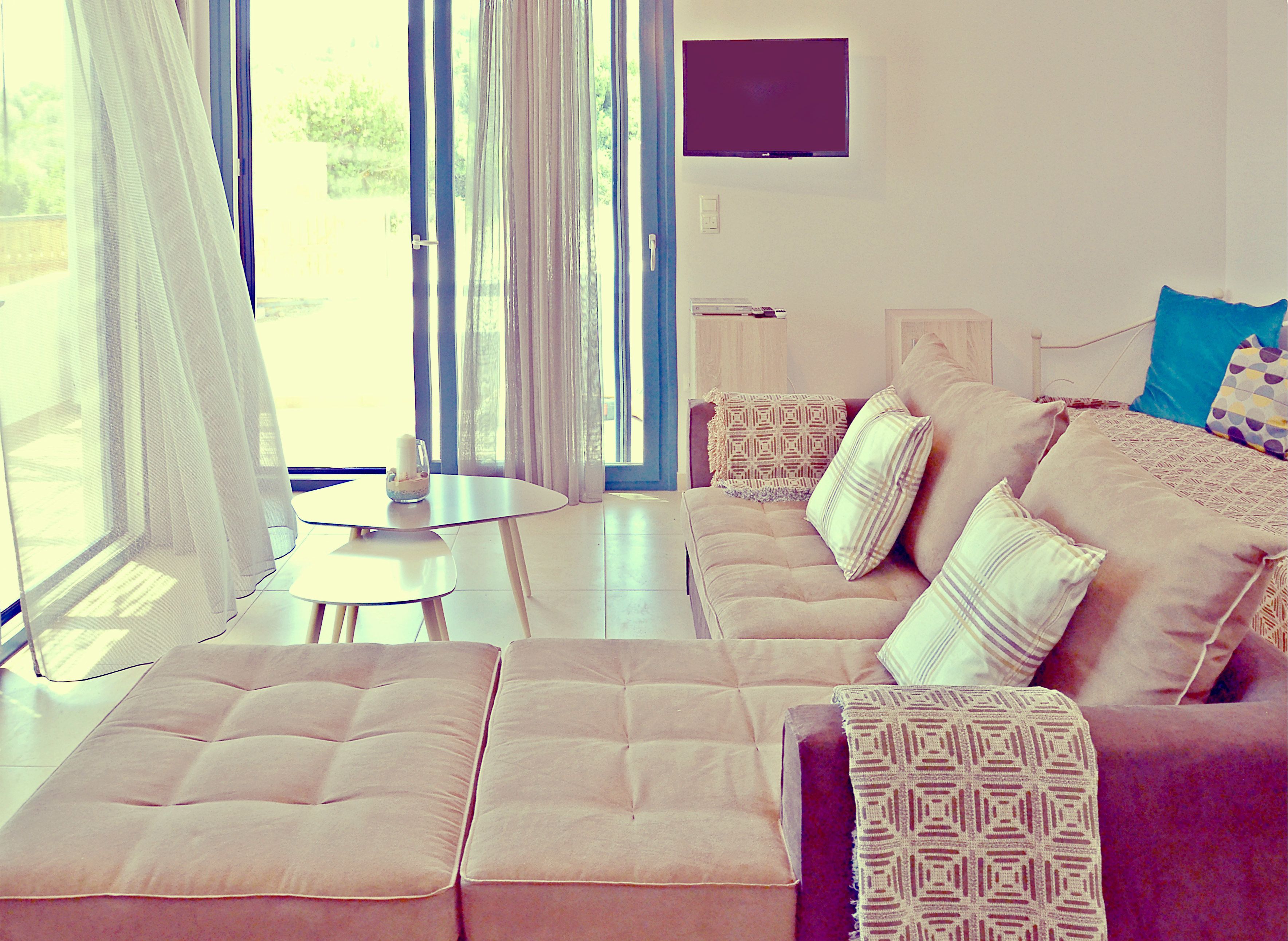 Luxury Villa, 1 Bedroom, Partial Ocean View | Living area | Flat-screen TV, DVD player