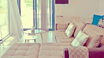 Luxury Villa, 1 Bedroom, Partial Ocean View | Living area | Flat-screen TV, DVD player