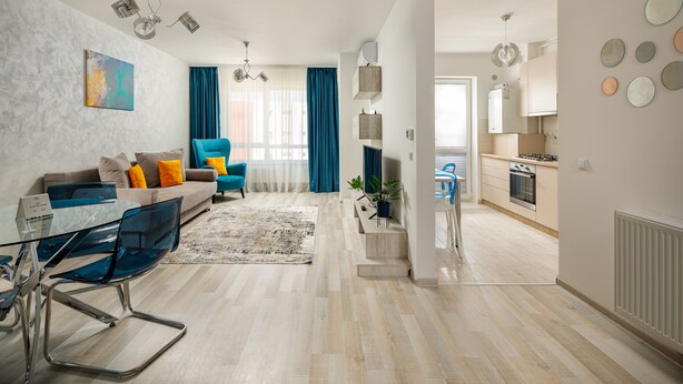 A modern apartment with a living room, dining area, and kitchen. - Brasov Holiday Apartments (Brasov)