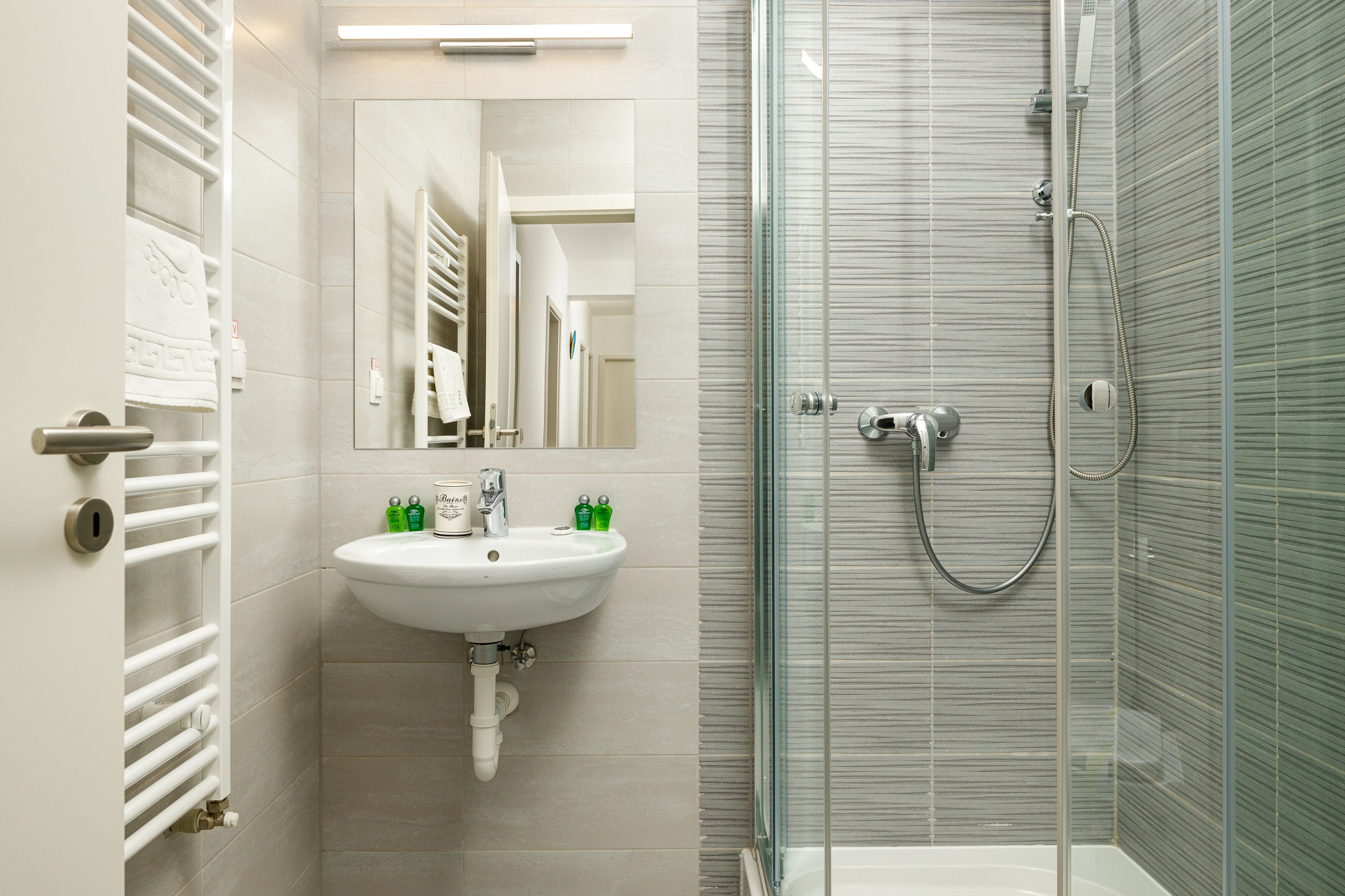 Deluxe Suite with Balcony (Breezy) | Bathroom | Designer toiletries, hair dryer, slippers, towels