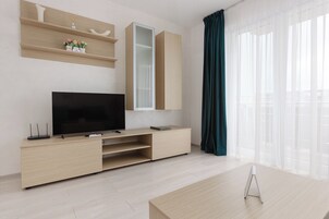 Junior Suite with Balcony (Colors) | Living area | 40-inch flat-screen TV with cable channels, TV