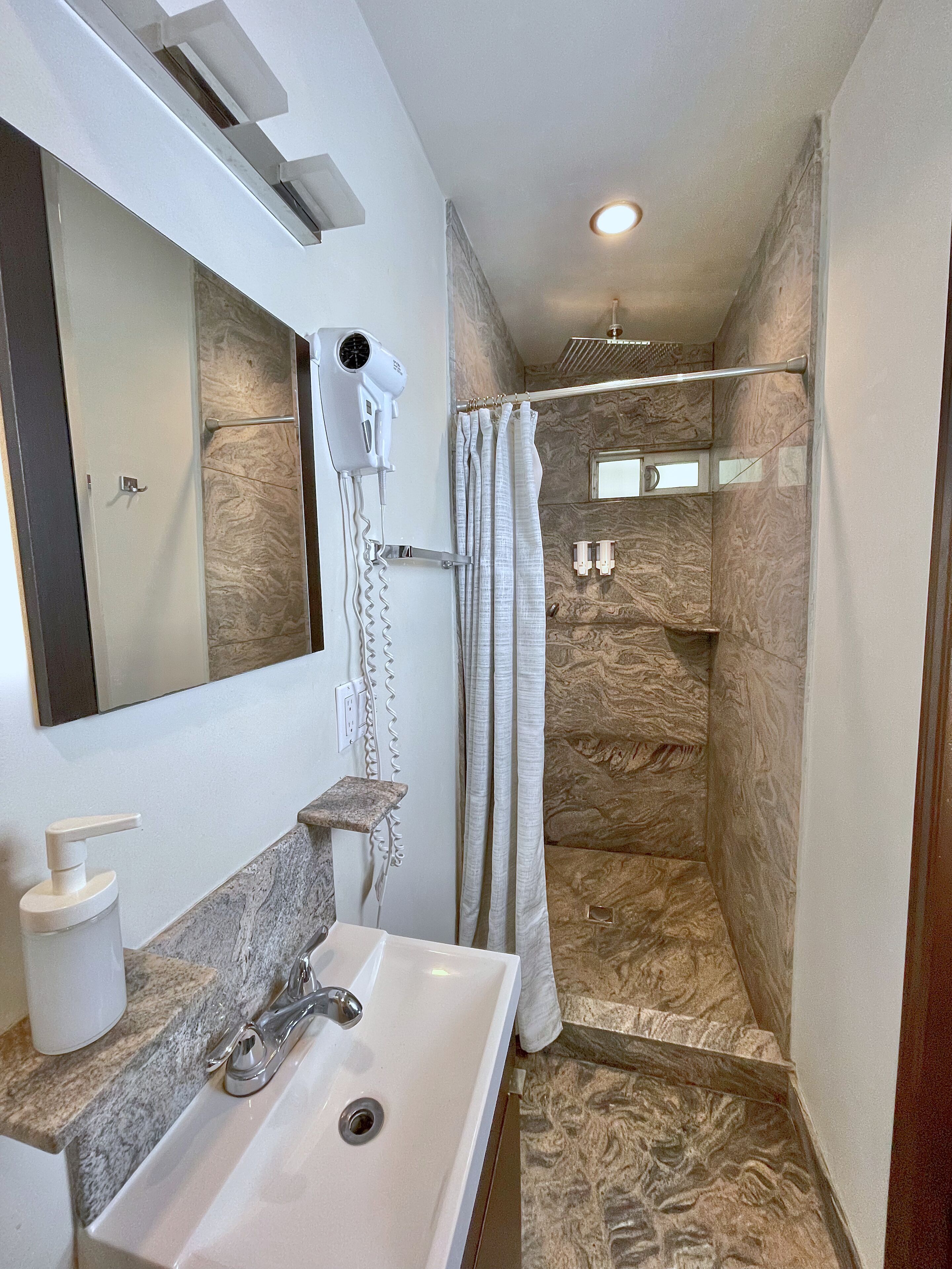 shower, free toiletries, hair dryer, towels