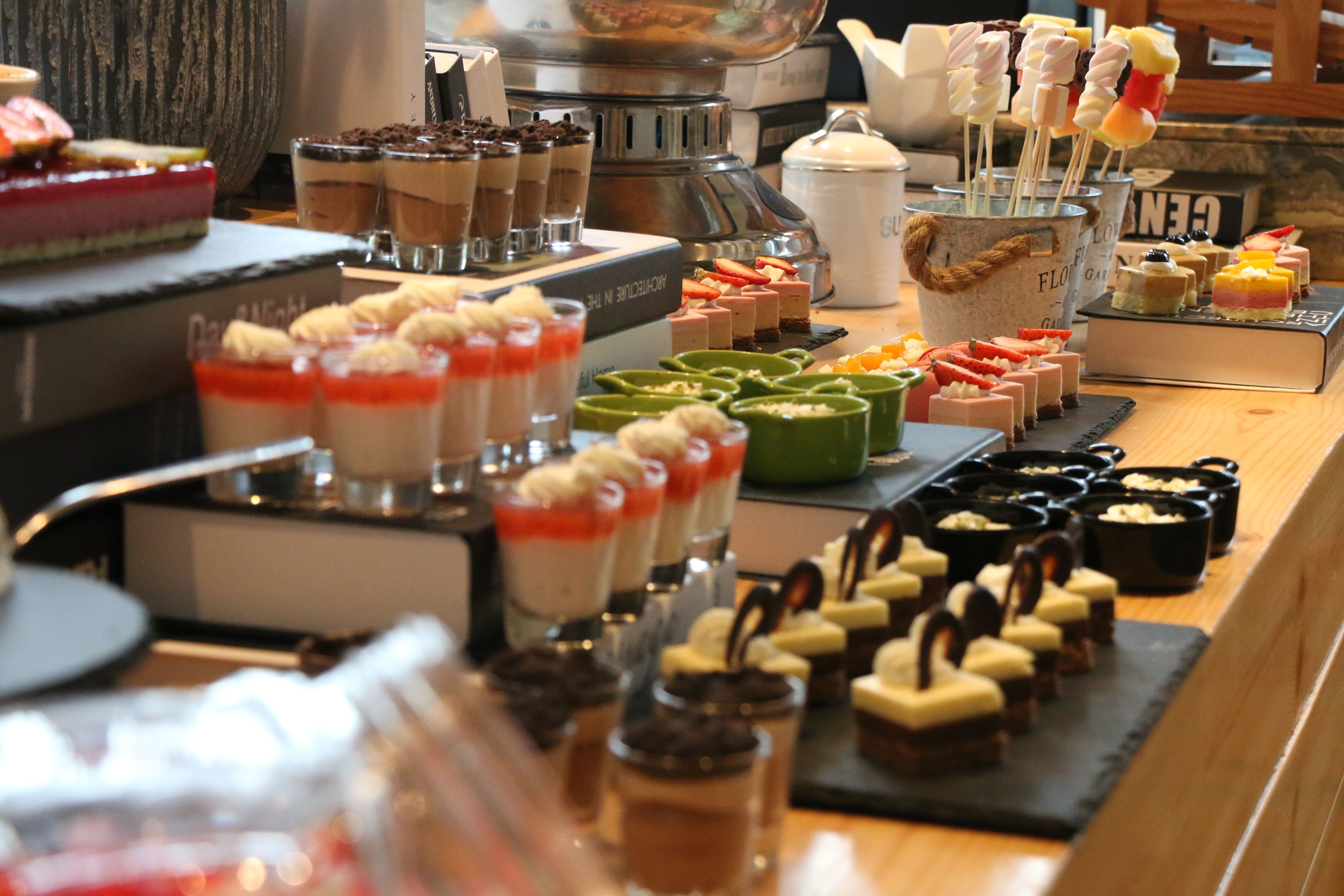 A variety of desserts and pastries displayed on a counter.