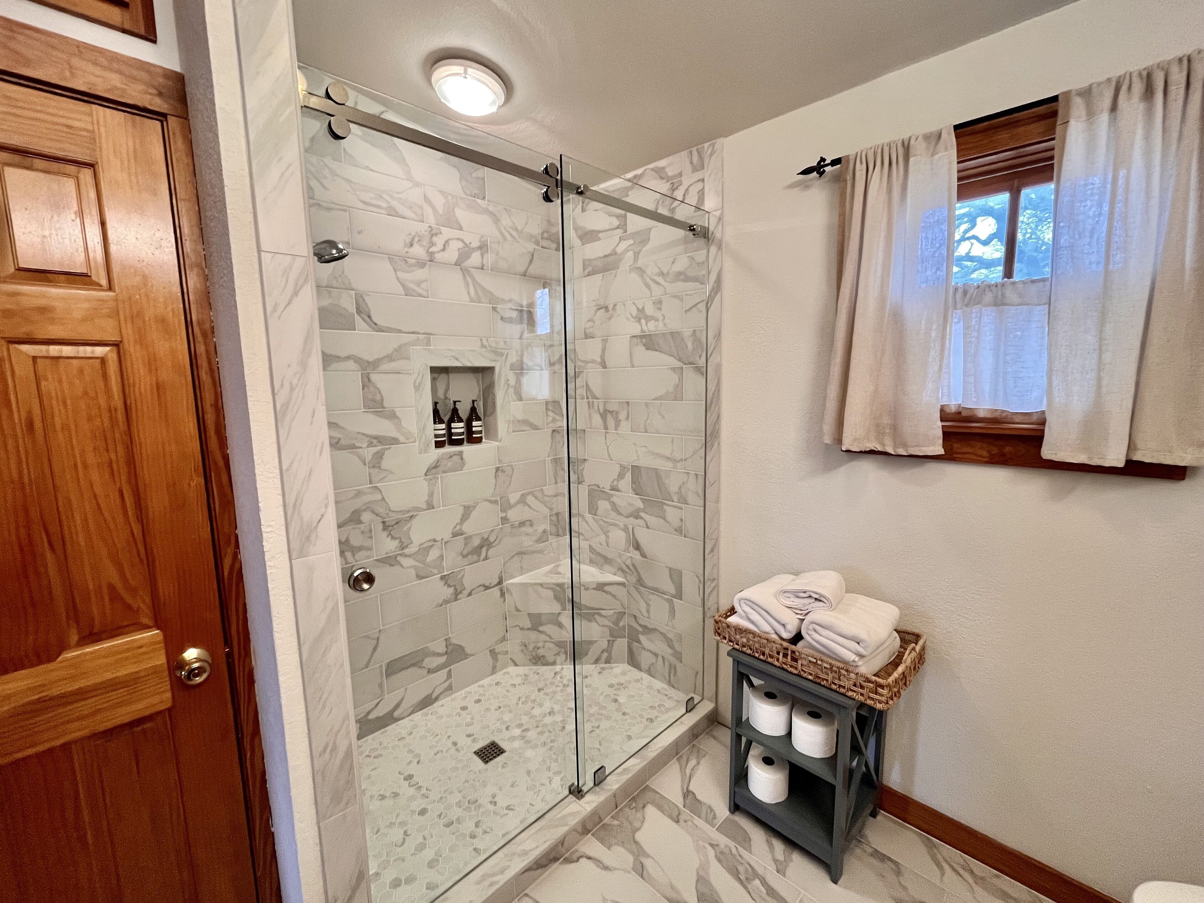Shower, hair dryer, towels, soap