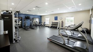 A gym with treadmills, weight machines, and dumbbells. - Hampton Inn & Suites Oklahoma City/Quail Springs (Oklahoma City)