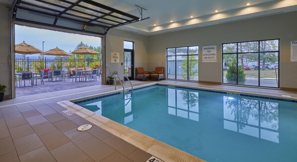 Indoor pool, open 8:00 AM to 11:00 AM, pool loungers