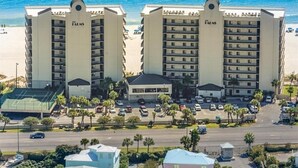 A hotel with a beach view, multiple floors, and a parking lot. - Breathtaking Views, Views, Views! Oceanfront wraparound balcony; 3 BR and 3 BA. (Orange Beach)