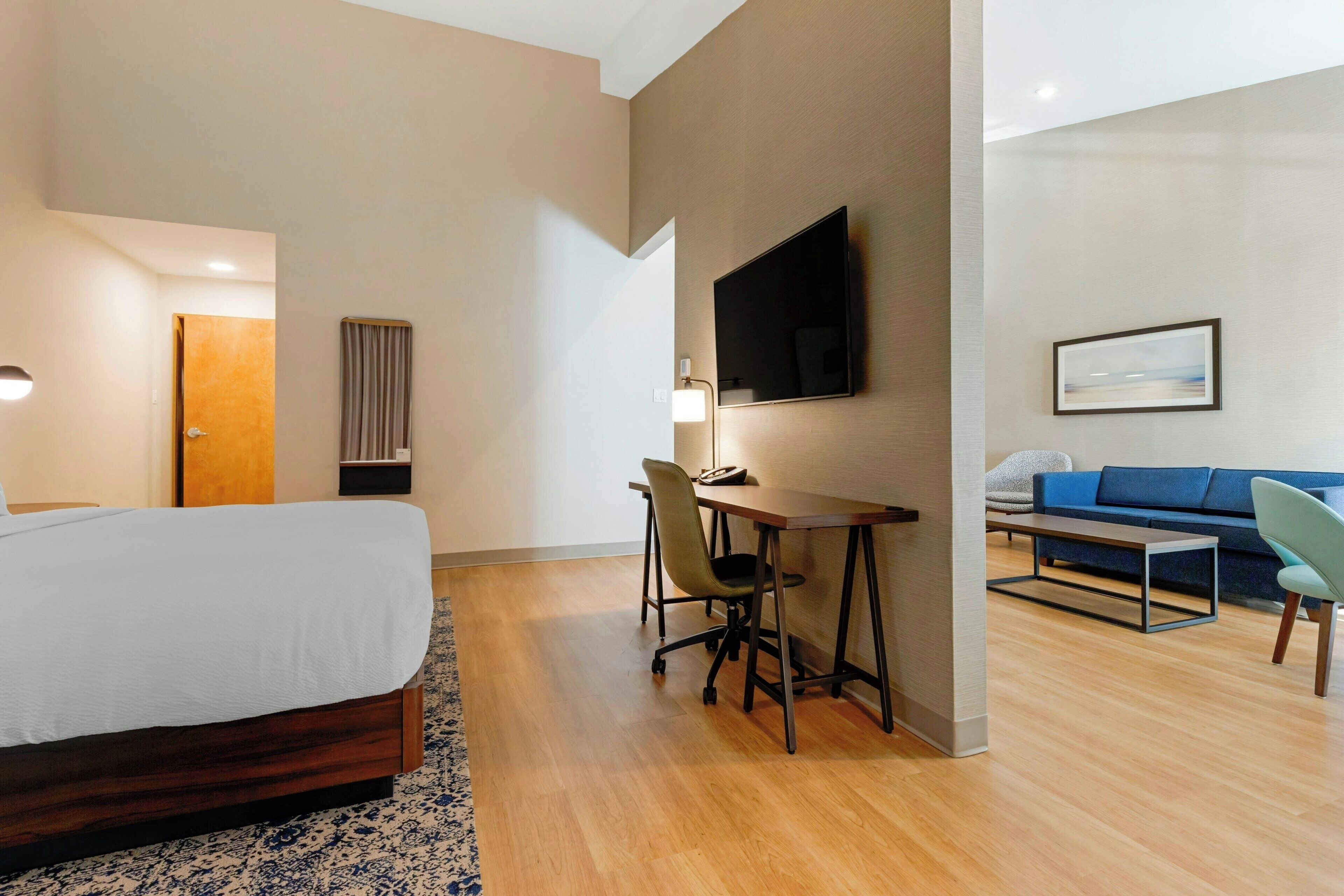 suite, 1 king bed, balcony, river view | in-room safe, desk, laptop workspace, blackout curtains