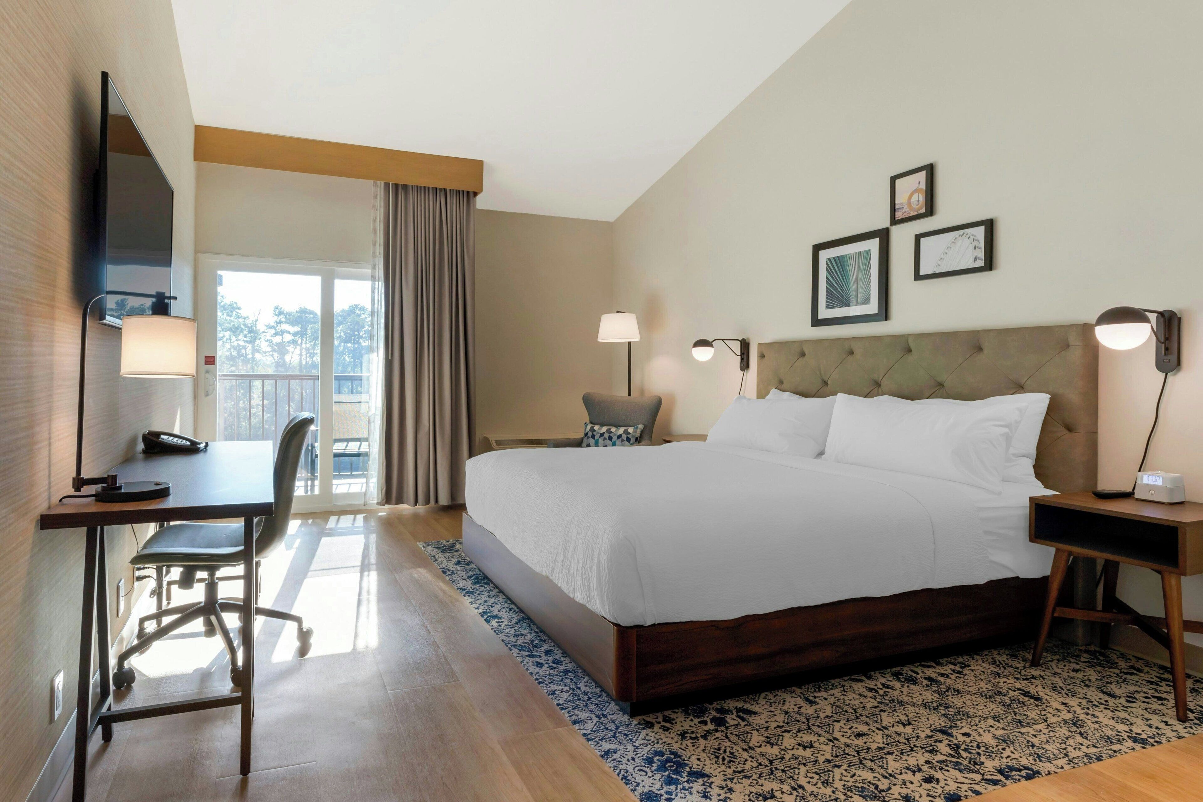deluxe room, 1 king bed, river view | in-room safe, desk, laptop workspace, blackout curtains
