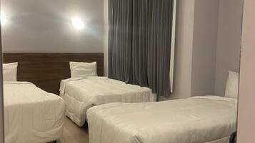 Standard Triple Room | Minibar, desk, iron/ironing board, free WiFi