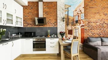 Premium Studio Suite, Kitchen | Private kitchenette | Full-size fridge, microwave, stovetop, dishwasher