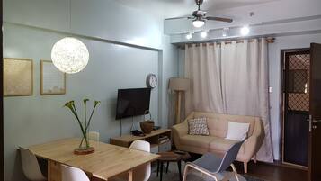 Condo, 2 Bedrooms | Living area | 32-inch flat-screen TV with satellite channels, TV