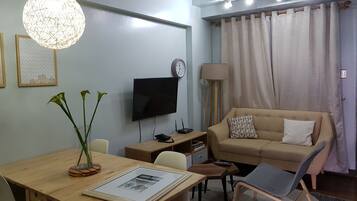 Condo, 2 Bedrooms | Living area | 32-inch flat-screen TV with satellite channels, TV