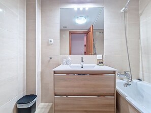 Bathtub, hair dryer, towels