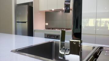 Luxury Apartment, 2 Bedrooms | Private kitchen | Full-size fridge, microwave, oven, stovetop