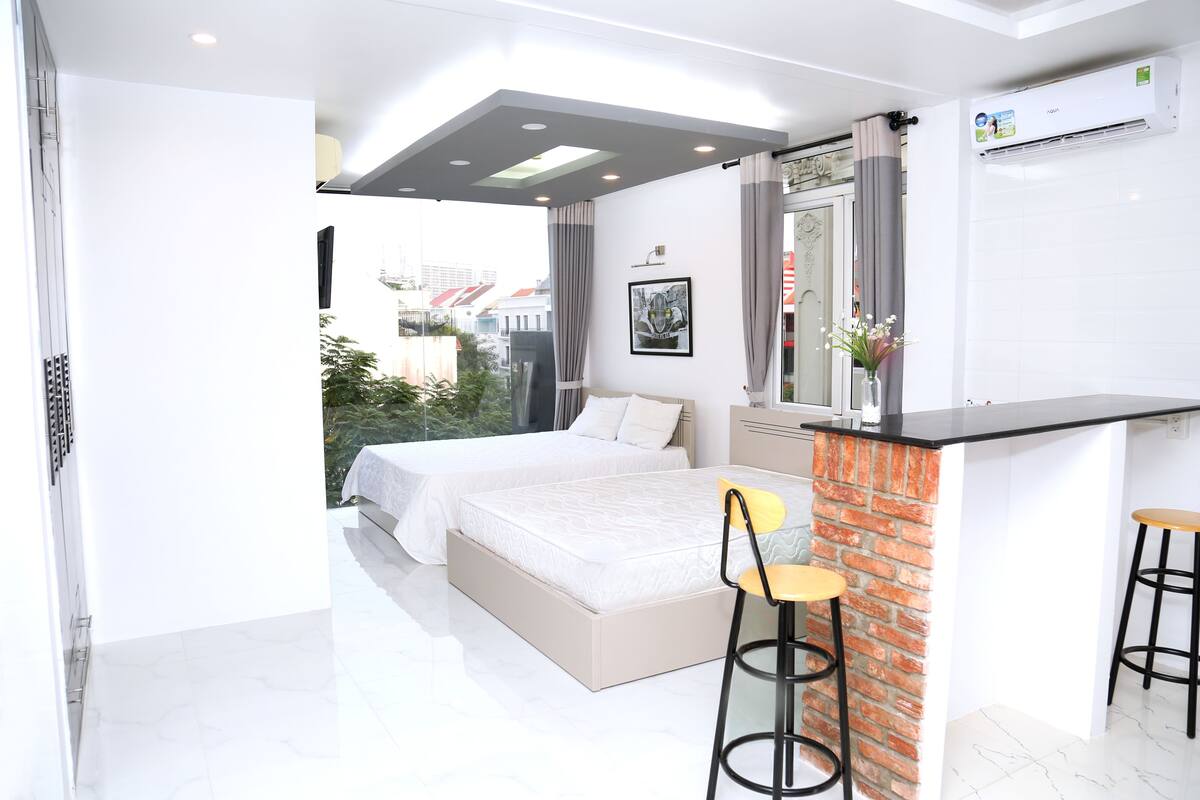 Senior Quadruple Room, 2 Queen Beds, Refrigerator & Microwave, City View | In-room dining