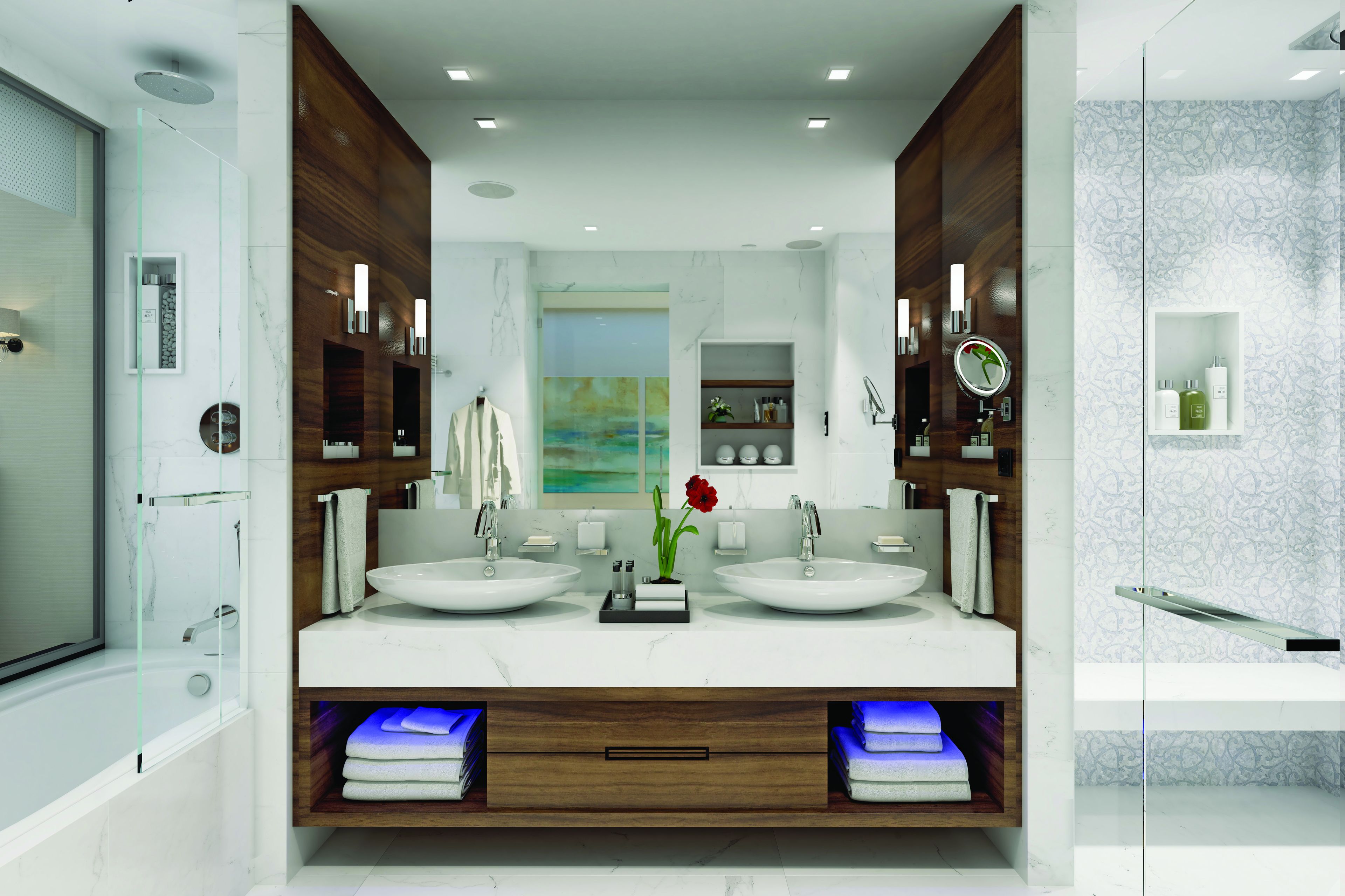 Une salle de bain moderne avec deux lavabos, un grand miroir et un espace douche.