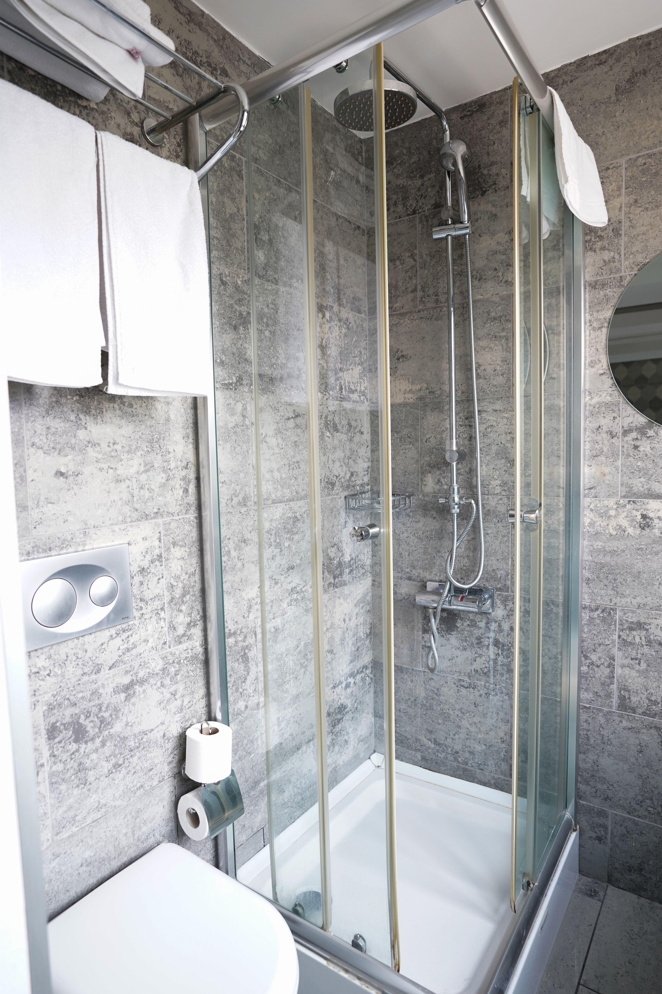 Shower, hair dryer, slippers, towels