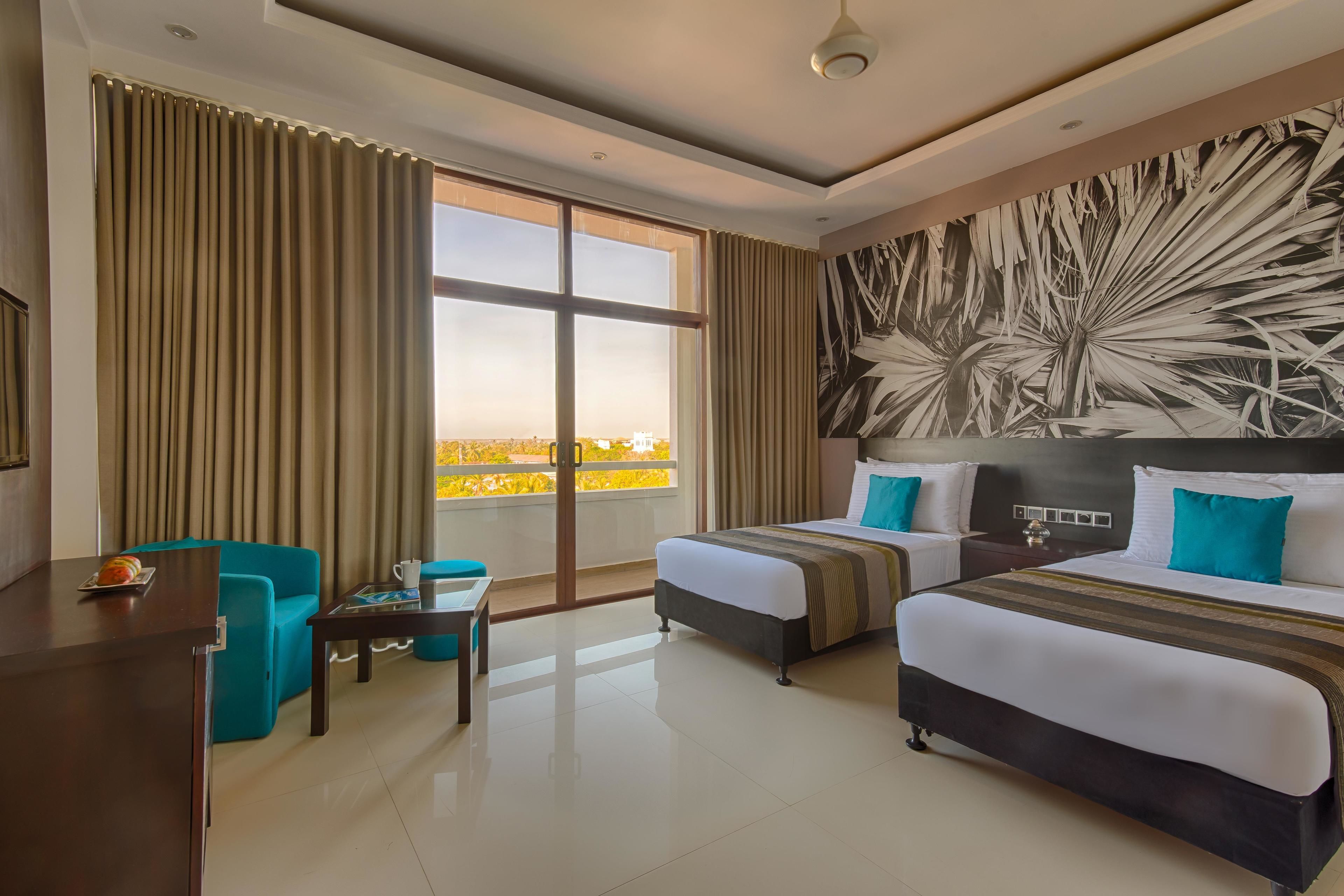 deluxe room | minibar, in-room safe, desk, laptop workspace