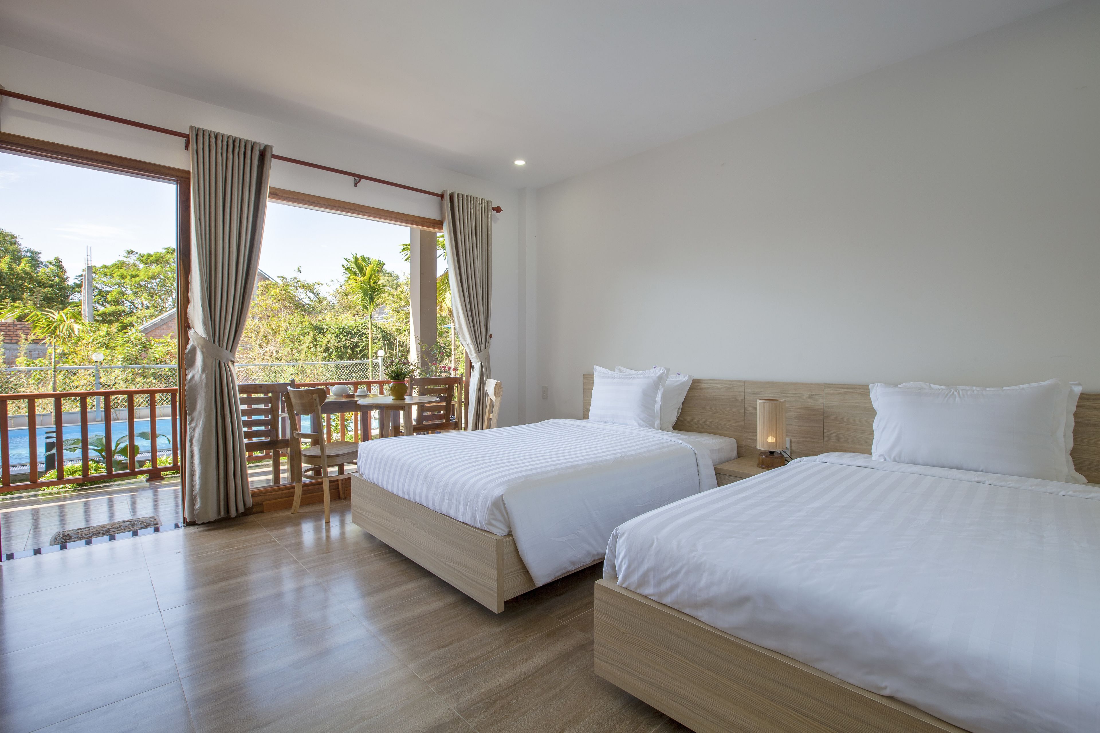 standard quadruple room, kitchen, pool view | interior