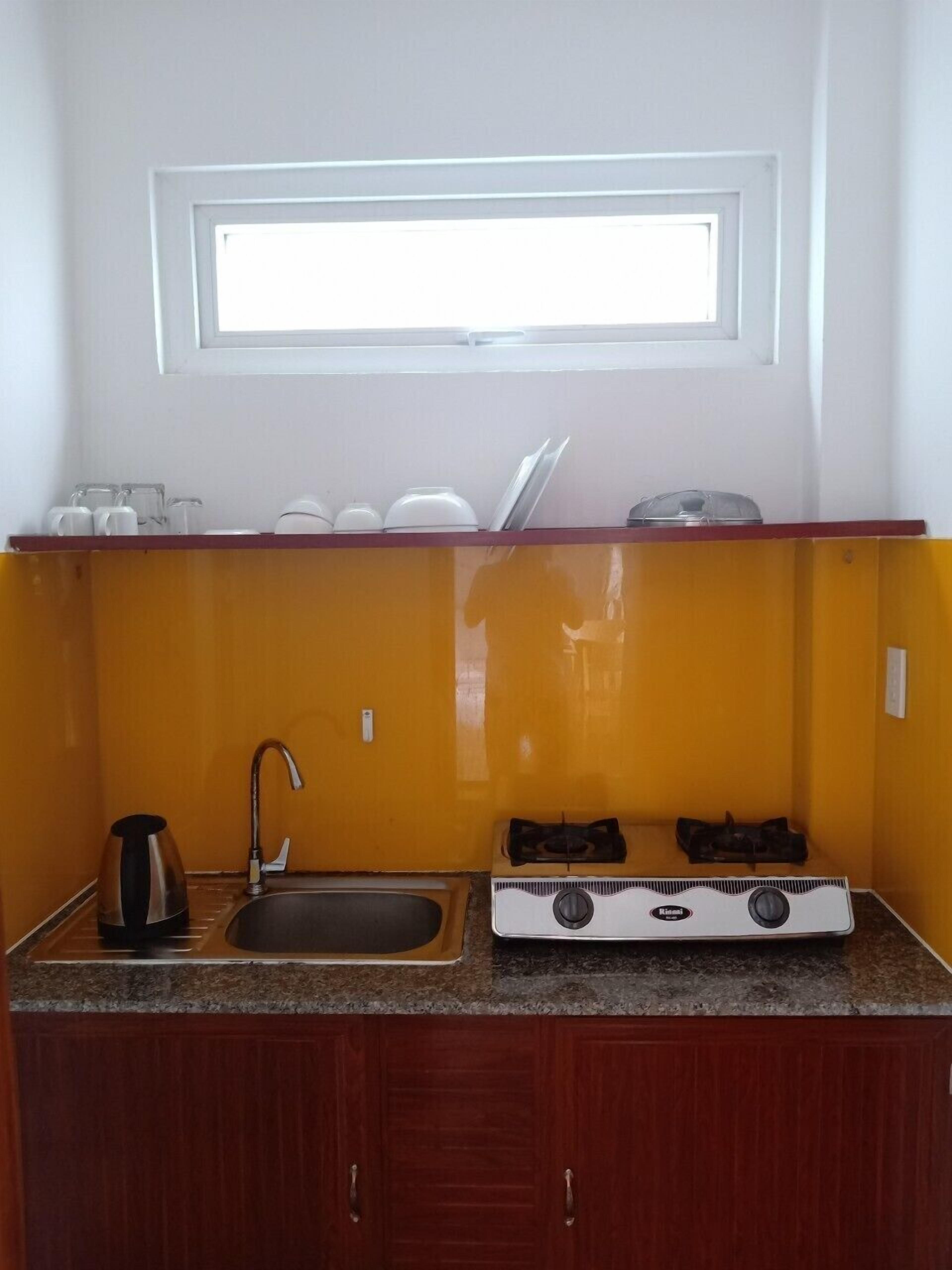 standard quadruple room, kitchen, pool view | private kitchen | fridge, stovetop, electric kettle