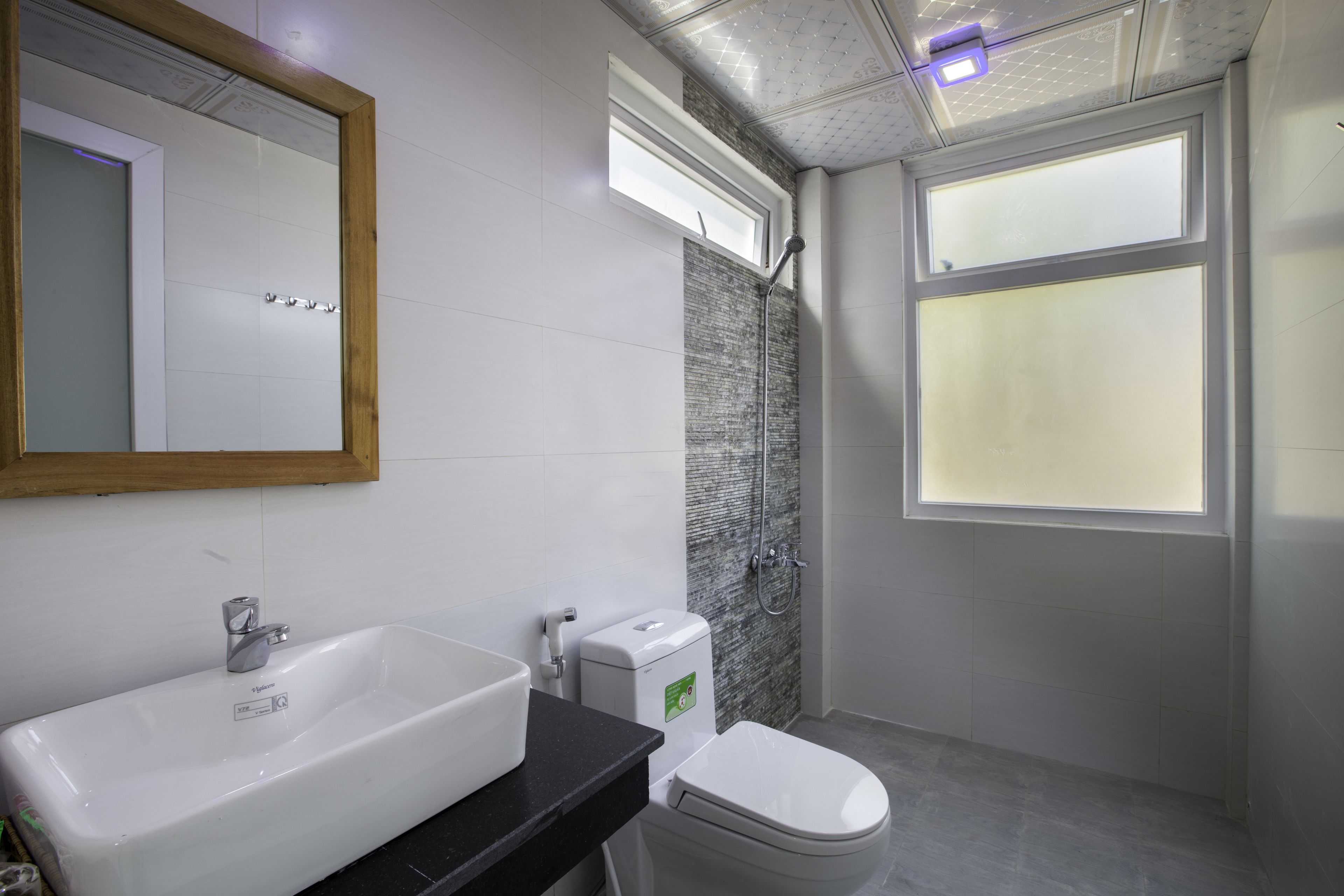 shower, designer toiletries, hair dryer, slippers