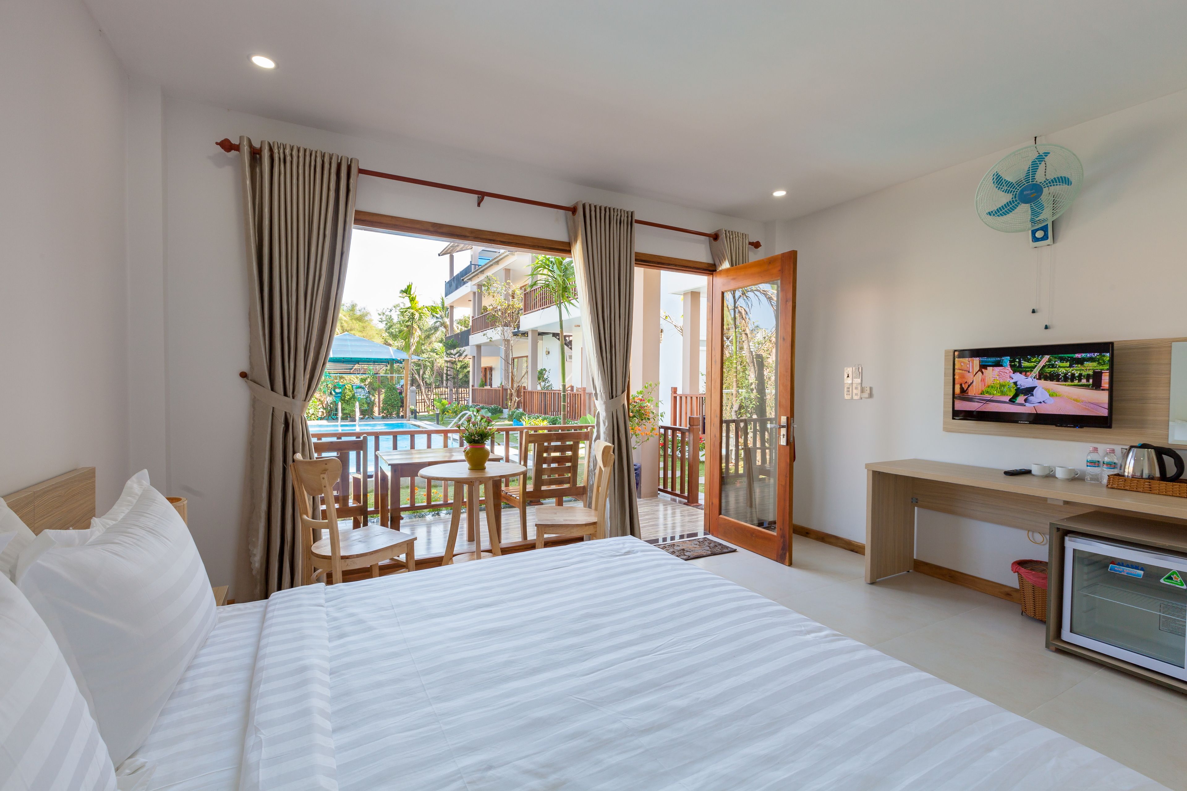 standard double room, pool view | view from room