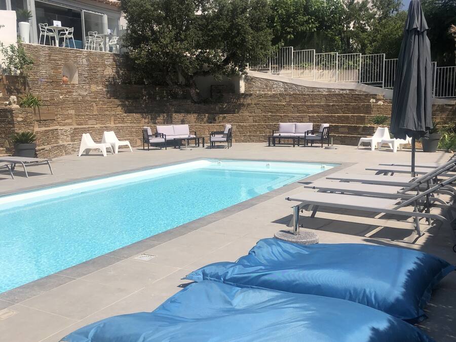 Seasonal outdoor pool, open 9:00 AM to 7:00 PM, pool umbrellas