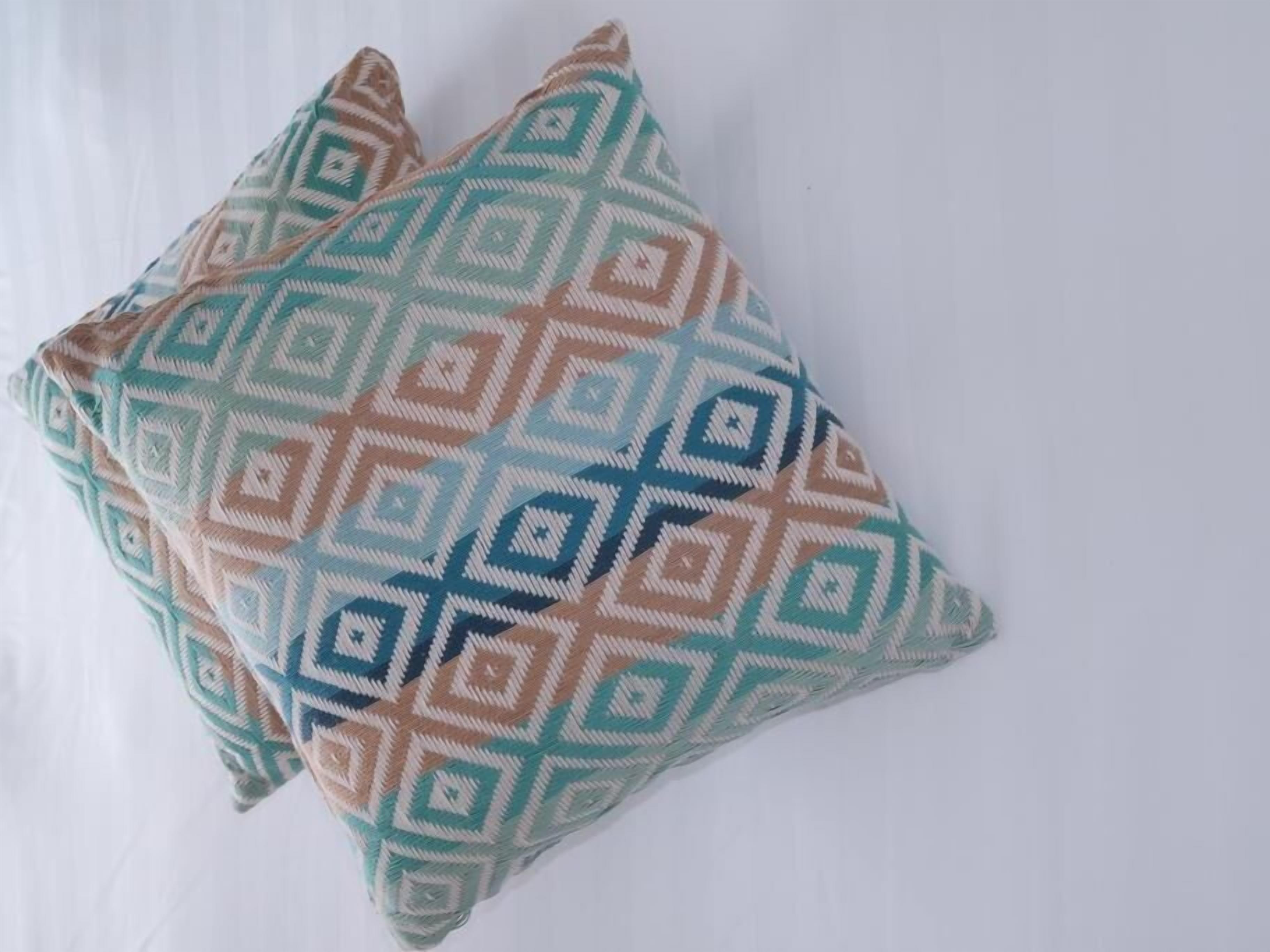 Two pillows with a geometric pattern.