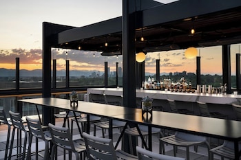 Enjoy al fresco dining with expansive city views and a contemporary design. at The Jacquard, Autograph Collection