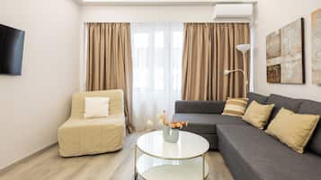 Apartment, 1 Bedroom, City View | Desk, soundproofing, iron/ironing board, free cots/infant beds