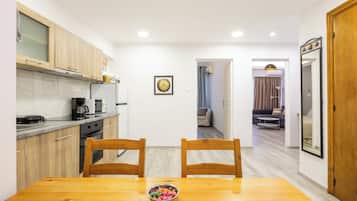 Apartment, 1 Bedroom, City View | Desk, soundproofing, iron/ironing board, free cots/infant beds