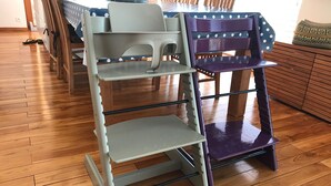 A dining area with a wooden table, chairs, and a multi-tiered storage unit. - Panoramic Sea View. Take a walk to the medieval village. (Tourrettes-Sur-Loup)
