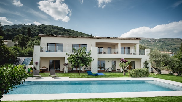 A two-story modern house with a swimming pool, surrounded by well-maintained lawn and trees. - Panoramic Sea View. Take a walk to the medieval village. (Tourrettes-Sur-Loup)