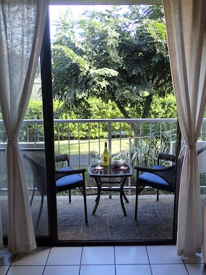 Lanai surrounded by lush tropical foliage