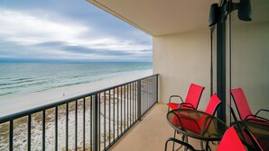 A balcony with a view of the beach and ocean. - *WEEKLY SPECIALS!* * Island Winds 1BR! (Gulf Shores)