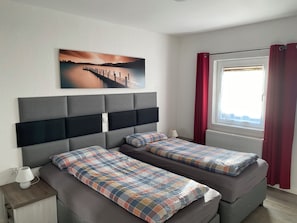 Appartement Confort, 2 chambres, terrasse, rez-de-chaussée