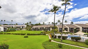 A resort with multiple-story buildings, a swimming pool, and well-maintained lawns. - Hale Kamaole 208 - Relax and Enjoy Your Beautiful Ocean View Suite (Kihei)