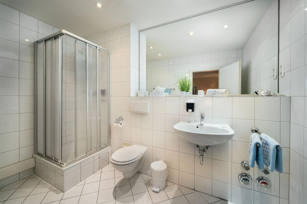 superior double room | bathroom | shower, free toiletries, hair dryer, slippers