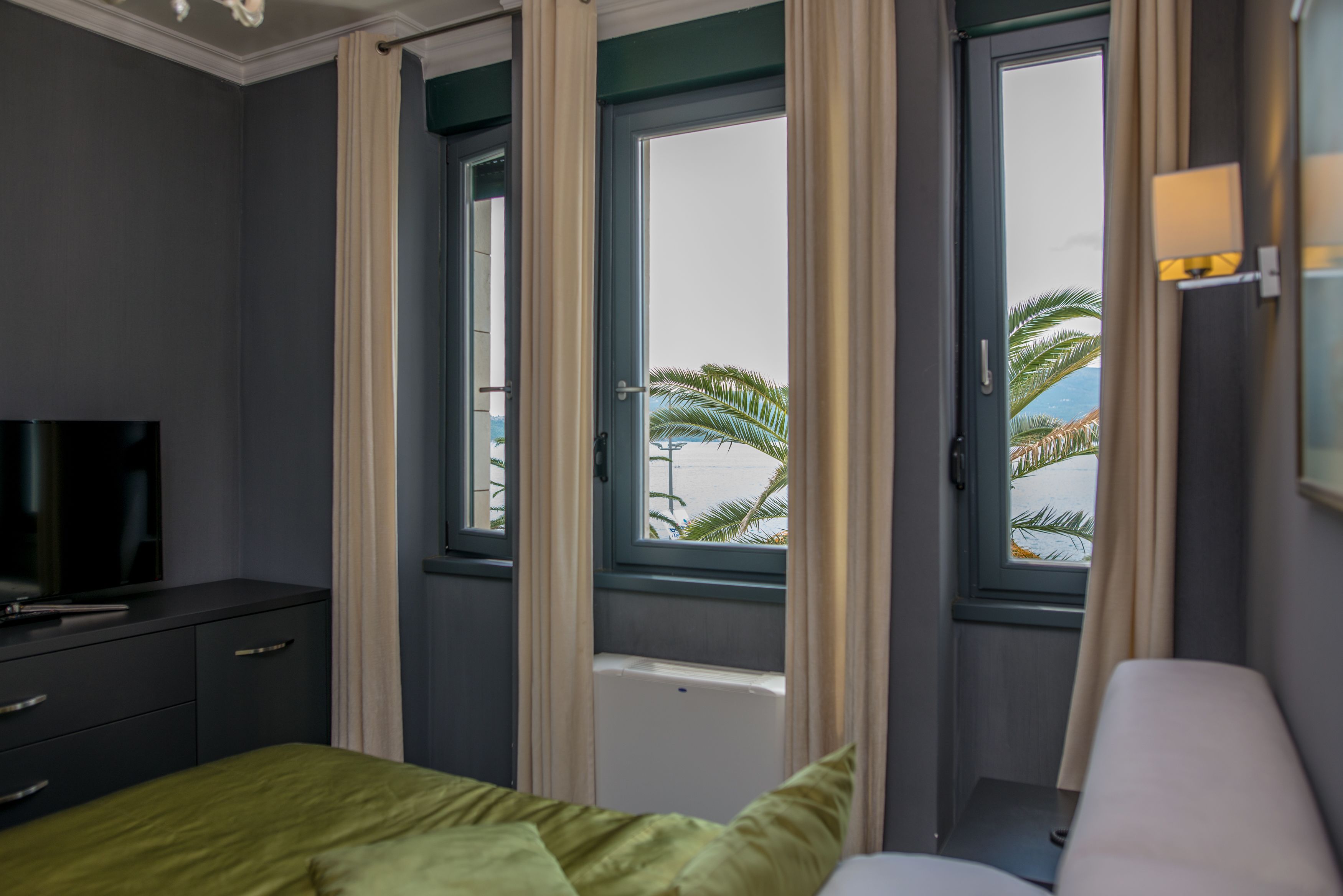 deluxe suite, bay view, sea facing | 1 bedroom, premium bedding, minibar, in-room safe