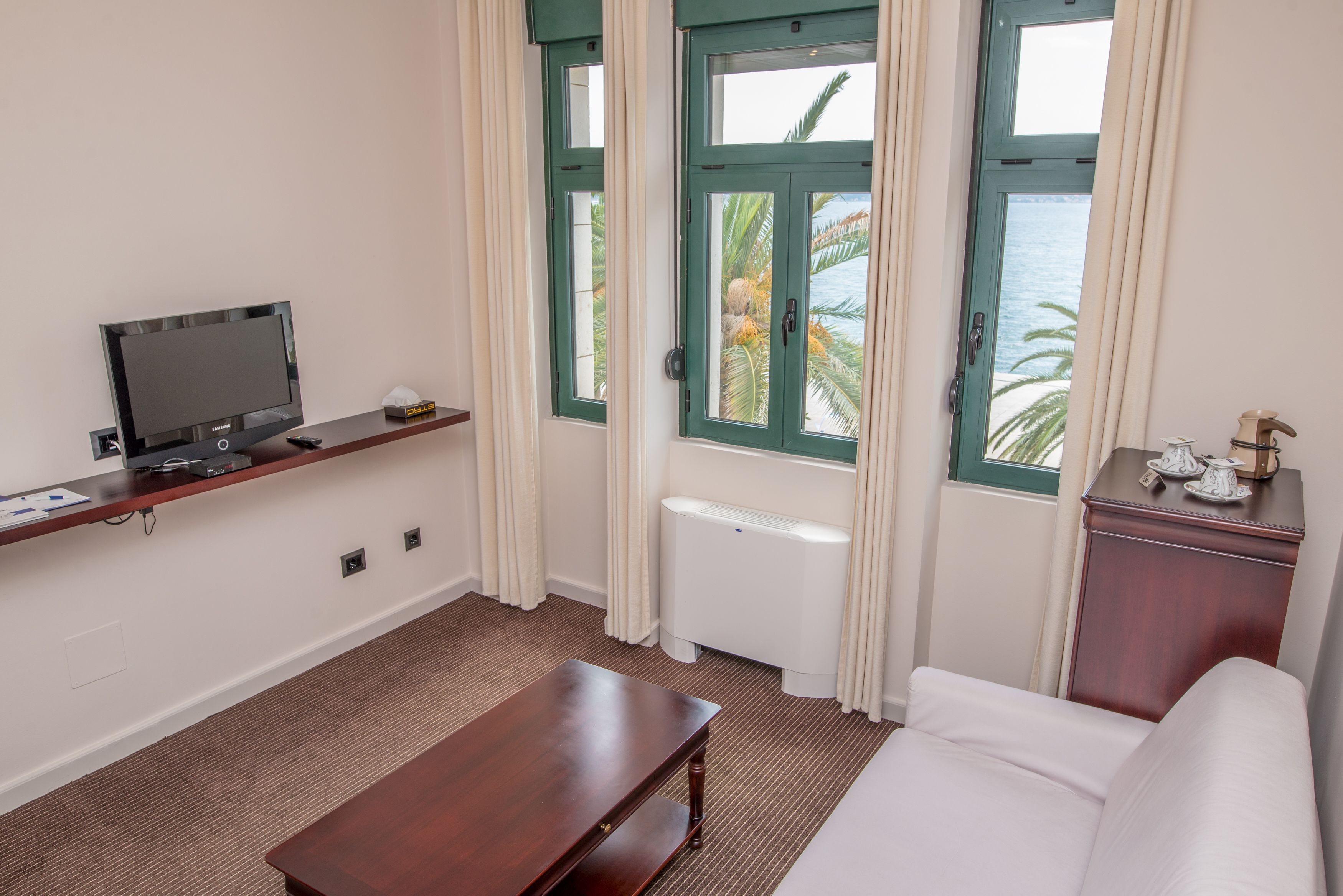 superior suite, bay view, sea facing | living room | flat-screen tv