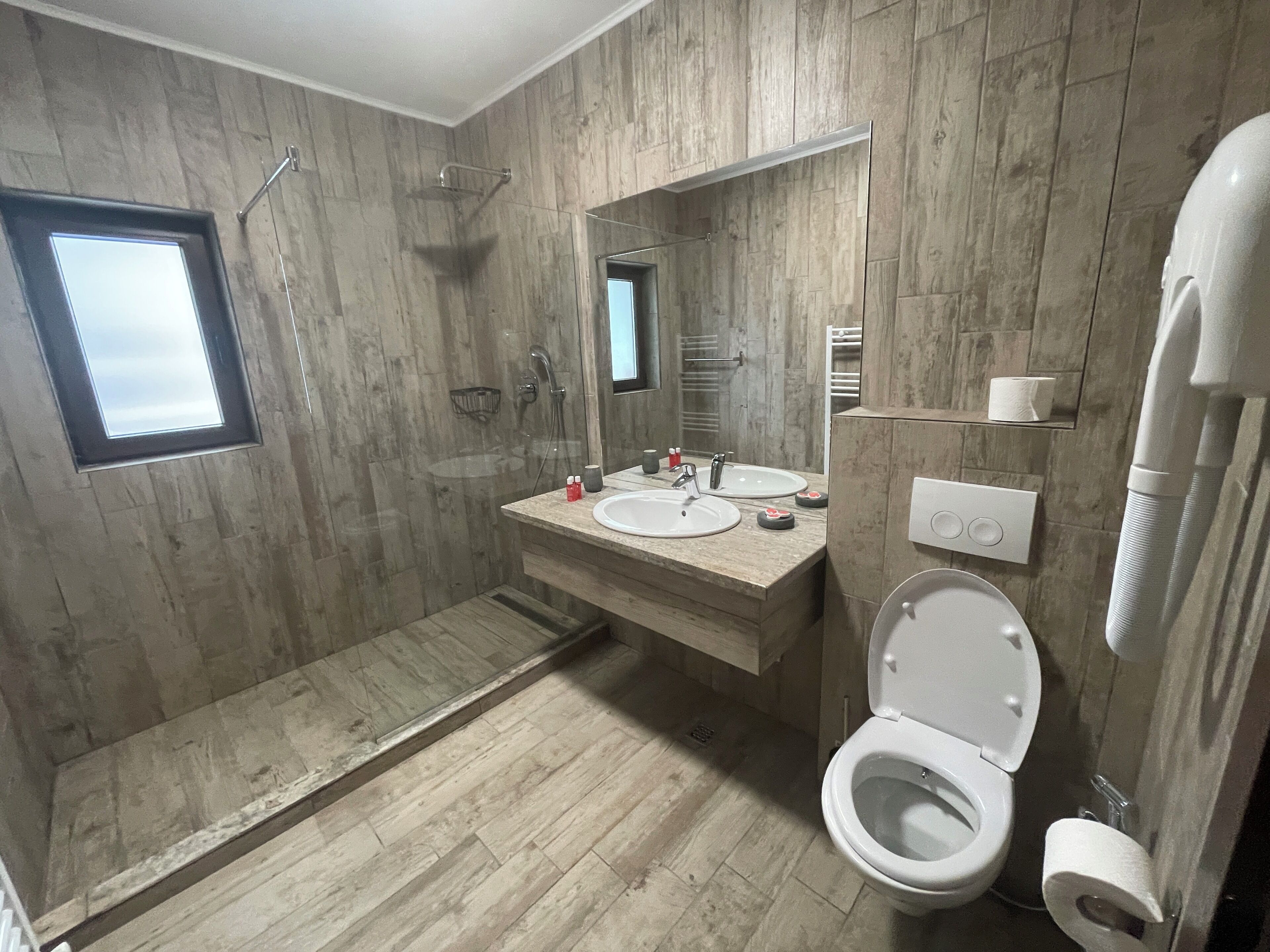 basic room | bathroom | hair dryer, towels, soap, shampoo