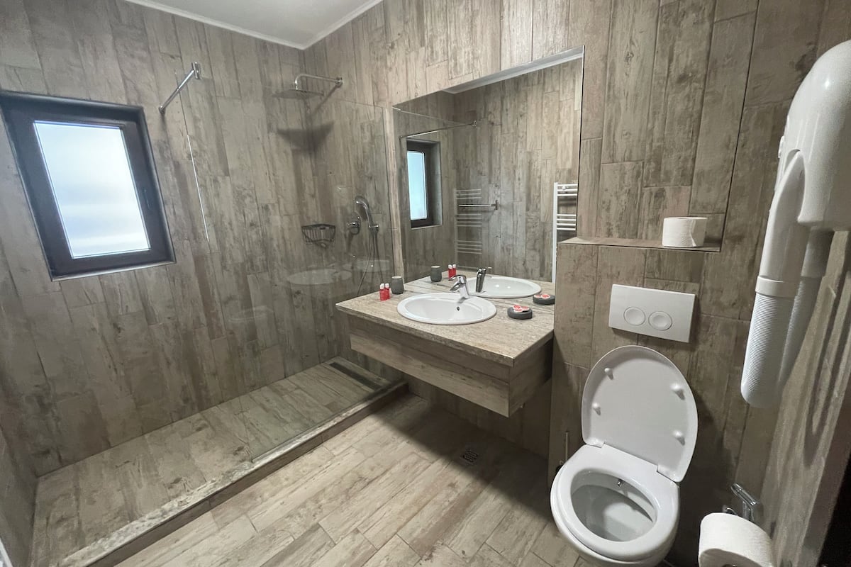 basic room | bathroom | hair dryer, towels, soap, shampoo