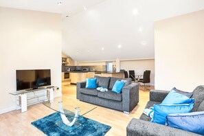 Elite Penthouse, 3 Bedrooms, 2 Bathrooms, Executive Level | Living area | 42-inch flat-screen TV with cable channels, TV, tablet - Magical Penthouse Next to Arena (Nottingham)