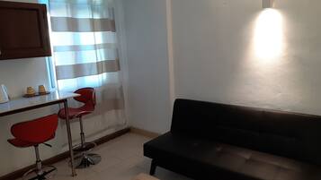 Deluxe Suite, 1 Bedroom | Living area | 40-inch LED TV with satellite channels, TV